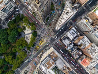 Fotobehang New York Aerial top down view of New York downtown street intersection and city park. Manhattan buildings with yellow cabs and cars  © marchello74