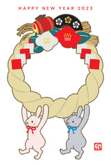フォトフレームの注連飾りを持ったうさぎの年賀状　2023年　年賀状　卯年　令和5年　縦位置