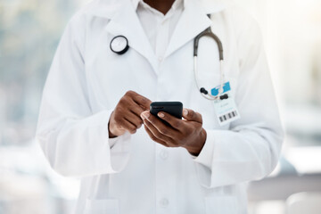 Doctor, hand and phone browsing the internet for medical reseacrch in a healthcare clinic for medicine. Wifi, social media and online search of cardiologist for examination treatment or cure