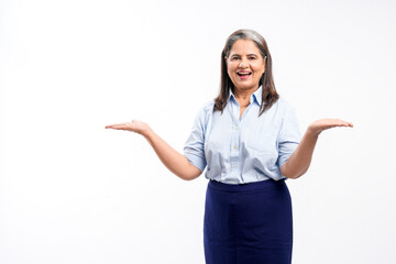 Young indian businesswoman or employee giving expression on white background.