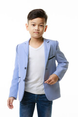 Half-body portrait of a young Asian boy in a casual jacket posing confidently looking at the camera on a white background. - 545336169