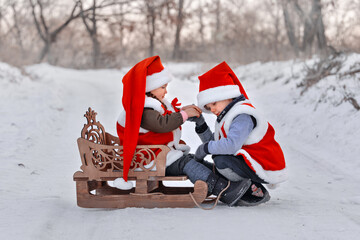 a boy and a girl are taking gifts to Santa Claus on a sleigh. new Year's miracle for children