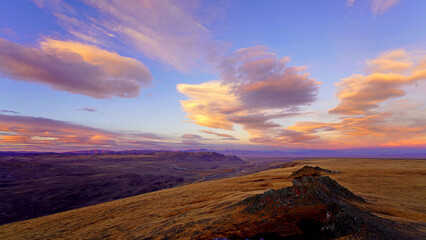 amazing colorful sunset clouds over tableland, panoramic wide angle dramatic sky landscape