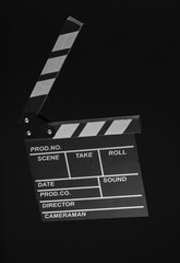 Fototapeta na wymiar Movie clapperboard isolated on black background