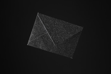 Black envelope isolated on black background