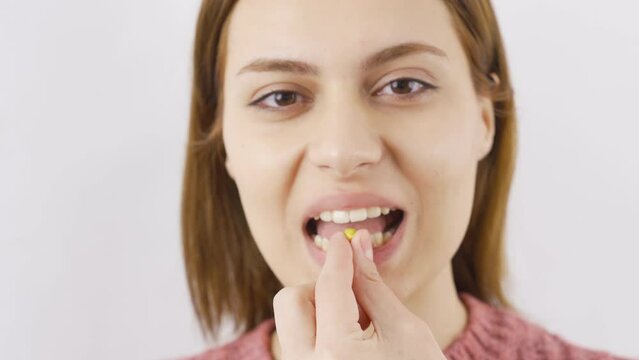 Woman eating Peanut in close-up. Hazelnut.
Woman eating peanuts in close-up.
