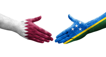 Handshake between Solomon Islands and Qatar flags painted on hands, isolated transparent image.