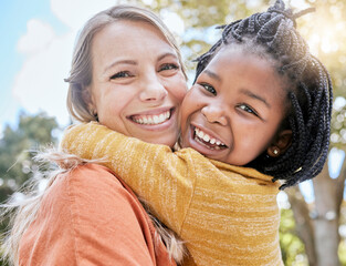 Mom, child and interracial hug in park with smile, trees and sunshine in summer together for...