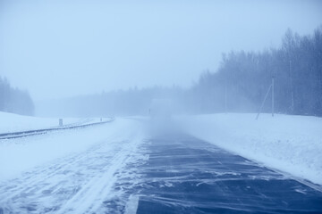 winter highway snowfall background fog poor visibility