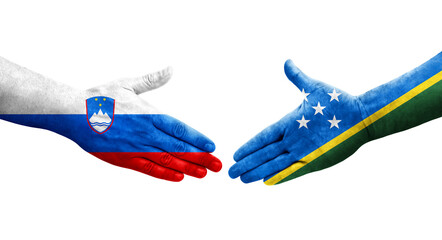 Handshake between Solomon Islands and Slovenia flags painted on hands, isolated transparent image.