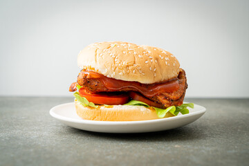 grilled chicken burger with sauce on plate
