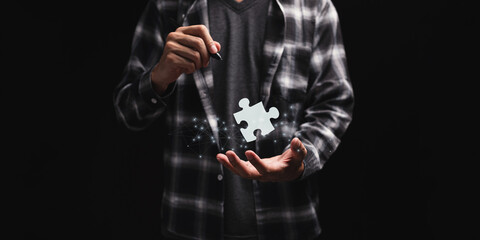 Fototapeta na wymiar Business Find new solutions, success and strategy connecting assembling jigsaw puzzle