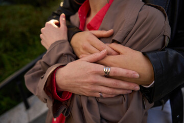 Woman hugs her girlfriend from the back