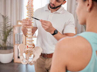 Chiropractor, spine and anatomy with a medical skeleton for advice and diagnosis of injury during physiotherapy with therapist and patient. Man talking to woman for chiropractic and physical therapy - obrazy, fototapety, plakaty