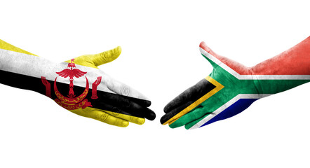 Handshake between South Africa and Brunei flags painted on hands, isolated transparent image.