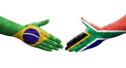 Handshake between South Africa and Brazil flags painted on hands, isolated transparent image.