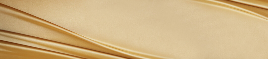 Golden silk satin. Luxury royal rich background with space for design. Soft folds. Shiny smooth fabric. Banner. Wide. Long. Panoramic. Anniversary, award, Christmas, Birthday, wedding. Template.