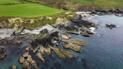 Rocks on the Irish coast, top view. The coast of the Atlantic Ocean. Nature of Northern Europe. Rocky coastline.
