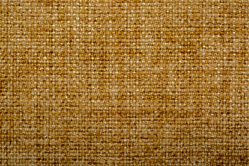 Close-up fabric swatches as a background. The texture of the material with patterns of weaving close-up. Upholstery fabric for interior decoration.