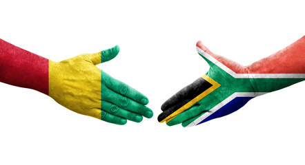 Handshake between South Africa and Guinea flags painted on hands, isolated transparent image.