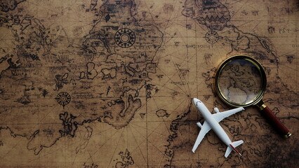 Magnifying glass placed on a vintage world map Travel ideas and places to visit