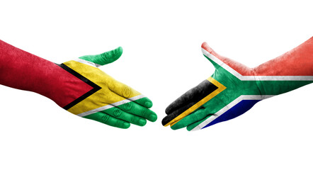 Handshake between South Africa and Guyana flags painted on hands, isolated transparent image.