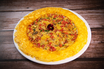Recipe Omelette with peppers, onions, tomatoes, courgettes and coriander. High quality photo