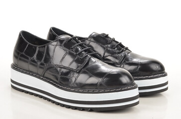 pair of black leather shoes