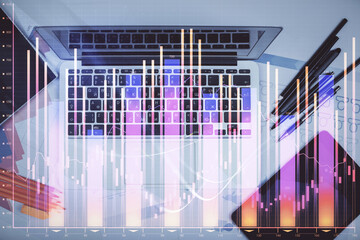 Multi exposure of forex chart drawing over table background with computer. Concept of financial research and analysis. Top view.