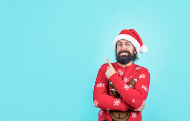 happy new year. merry christmas. cheerful bearded man in santa claus hat and sweater. brutal hipster celebrate xmas party. winter holiday preparations. present and gift shopping sale. For Santa