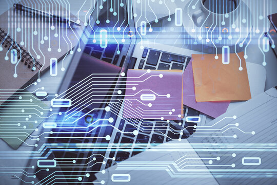 Double exposure of data hologram sketch over study table background with computer. Concept of Ai. Top view.