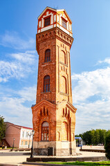 Fototapeta premium Old water tower on the city square