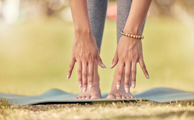 Hands, yoga and stretching with a sports woman practicing meditation on a field outdoor in summer. Fitness, peace and wellness with a female athlete getting ready for workout, exercise or meditation