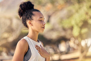 Black woman, breath and hand on chest, for meditation and wellness being peaceful to relax. Bokeh, African American female and lady outdoor, in nature and being calm for breathing exercise and health - obrazy, fototapety, plakaty