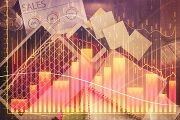 Financial market graph and top view computer on the desktop background. Multi exposure. Investment concept.
