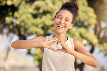 Fitness black woman with heart hand sign for love, body care or self care in nature park for cardio...