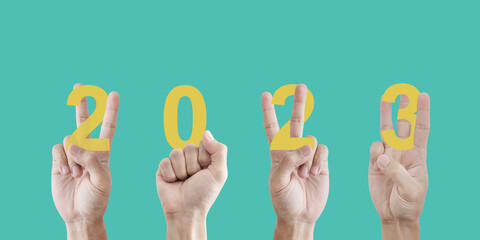 Digital collage, 2023 new year concepts, Hand showing 2023 new year hand signs