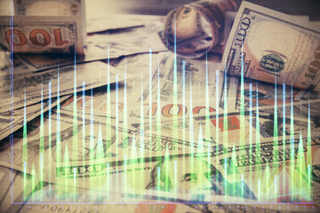 Multi exposure of forex chart drawing over us dollars bill background. Concept of financial success markets.