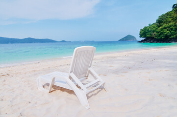 Vacation concept. Traveling by Thailand. Tropical Sea Beach with sunloungers.