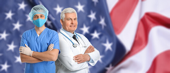 Portrait of male doctors against USA flag