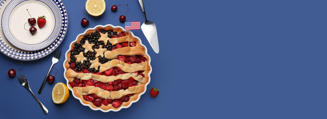 Composition with tasty American flag pie on blue background with space for text, top view