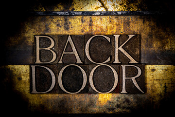 Backdoor text with on grunge textured copper and gold background