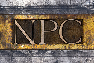 NPC text with on grunge textured copper and gold background 