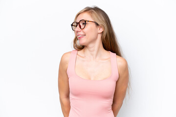 Young caucasian woman isolated on white background looking to the side and smiling