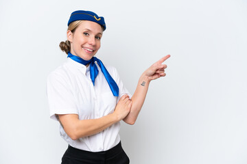 Airplane blonde stewardess woman isolated on white background pointing finger to the side