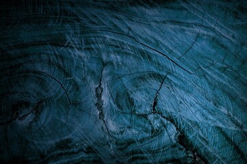 Illustration of dark blue background with wooden material texture with added effects