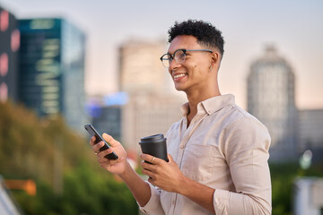 Black man, smartphone and coffee outdoor, in city and smile being trendy, casual and sunset. Gen z,...