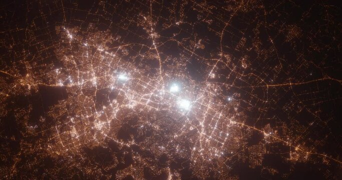 Austin (Texas, USA) top view at night. Aerial view on modern city from space. Camera is flying above the city, moving forward. Vertical video. The north is on the left side