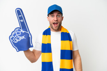 Young caucasian sports fan man isolated on white background with surprise facial expression