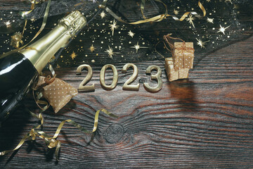 Happy New Year. Symbol from number 2023 on wooden background